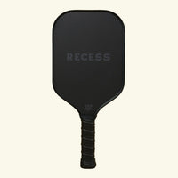 Recess Advanced Midnight pickleball paddle front view in all black with stealth RECESS logo and black carbon fiber face
